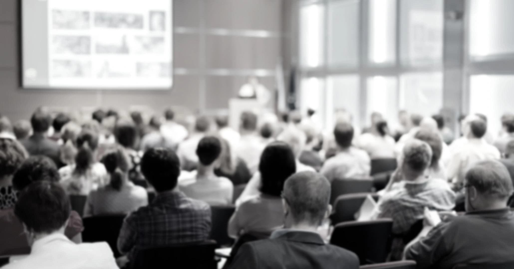 Background image showing people in a professional meeting setting